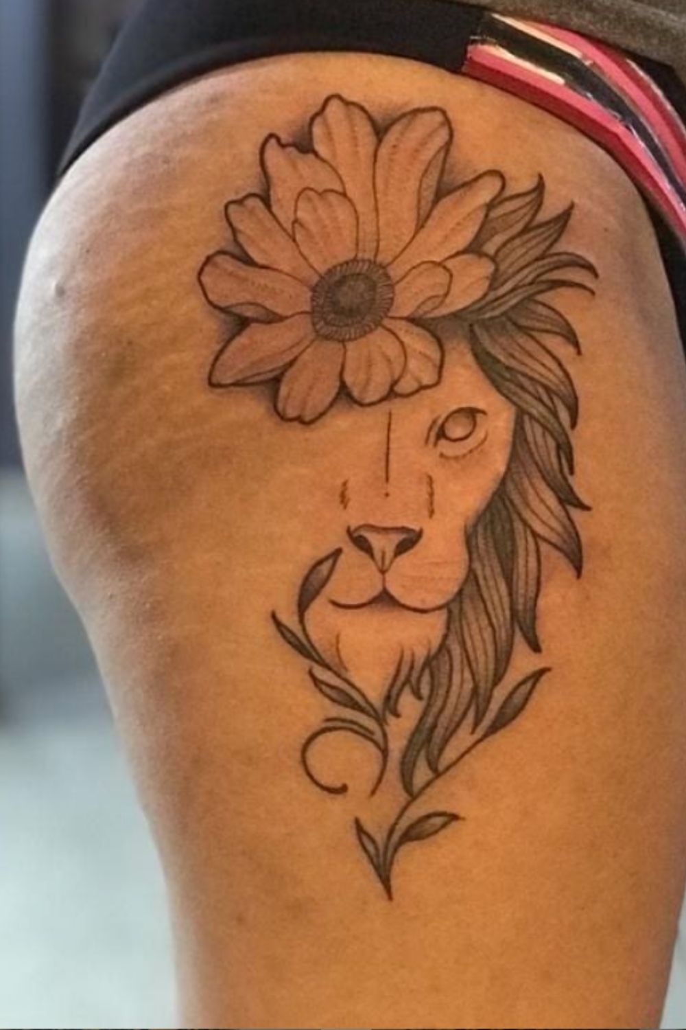 lion tattoo with flowers