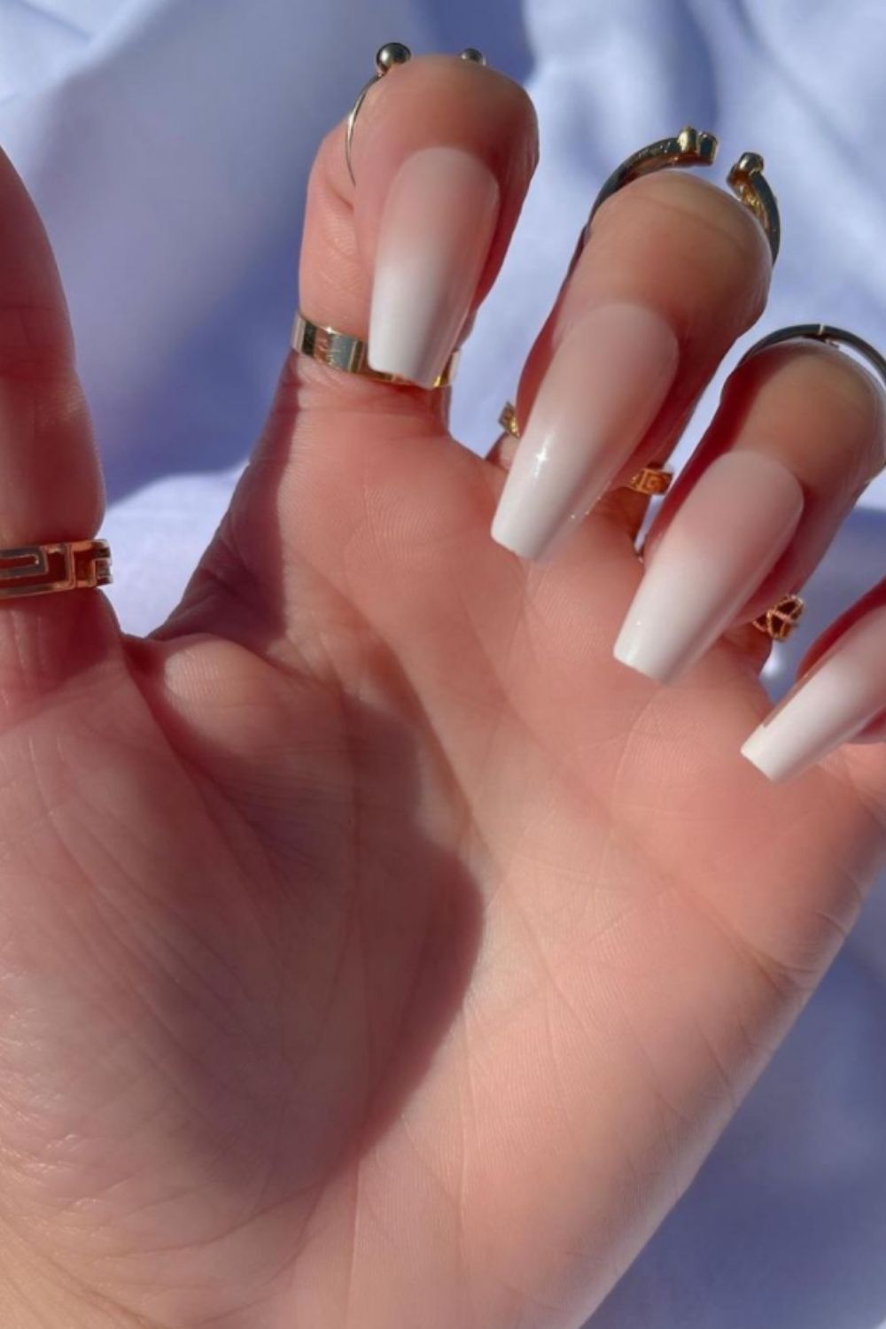 white acrylic nails with design coffin