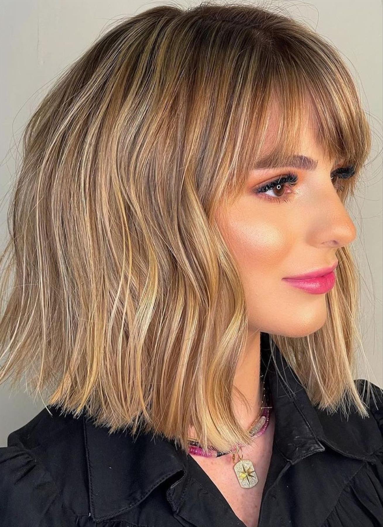 Trendy shoulder-length haircut with bangs for thick hair