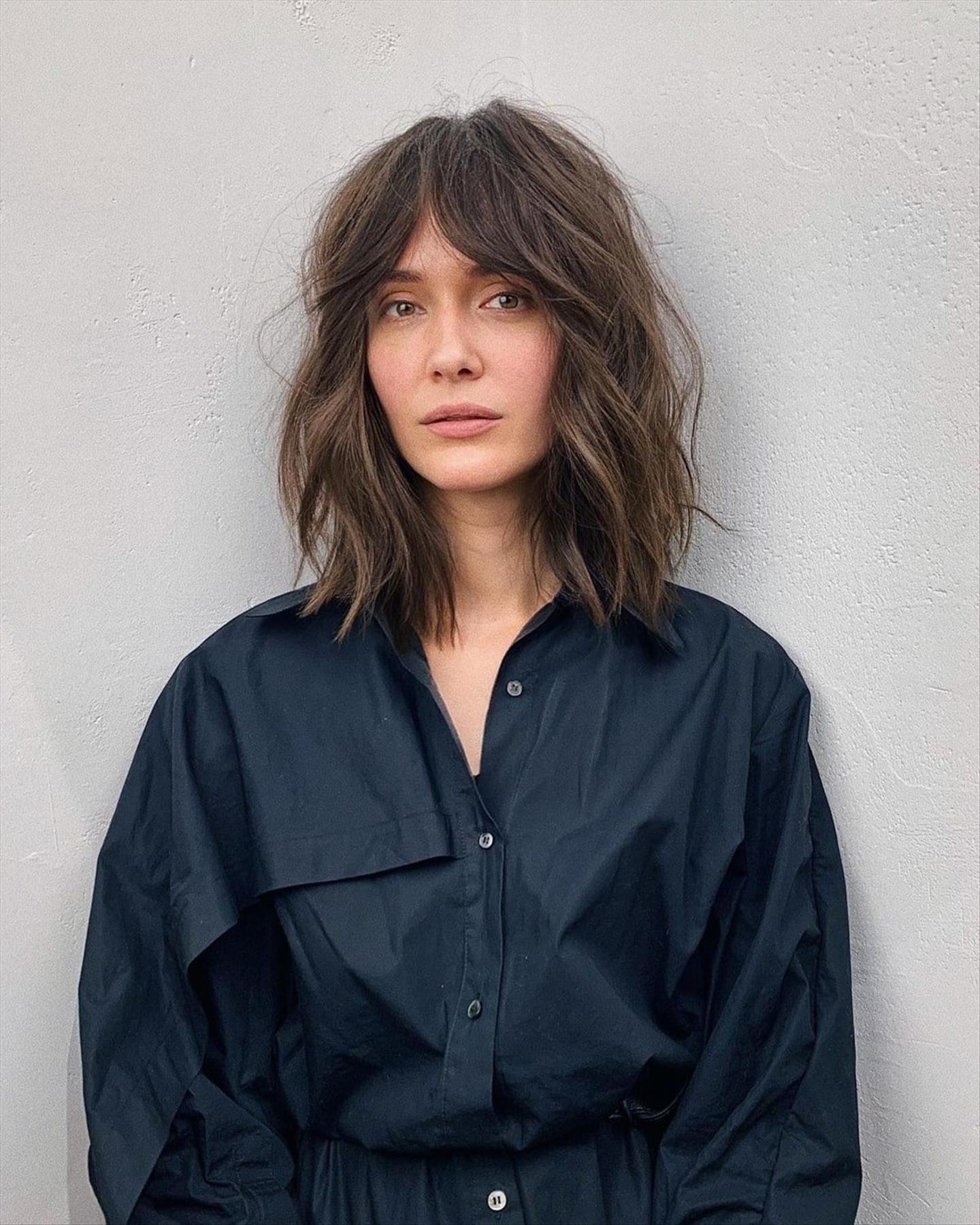 Cool shoulder-length haircuts with curtain bangs to try in 2024